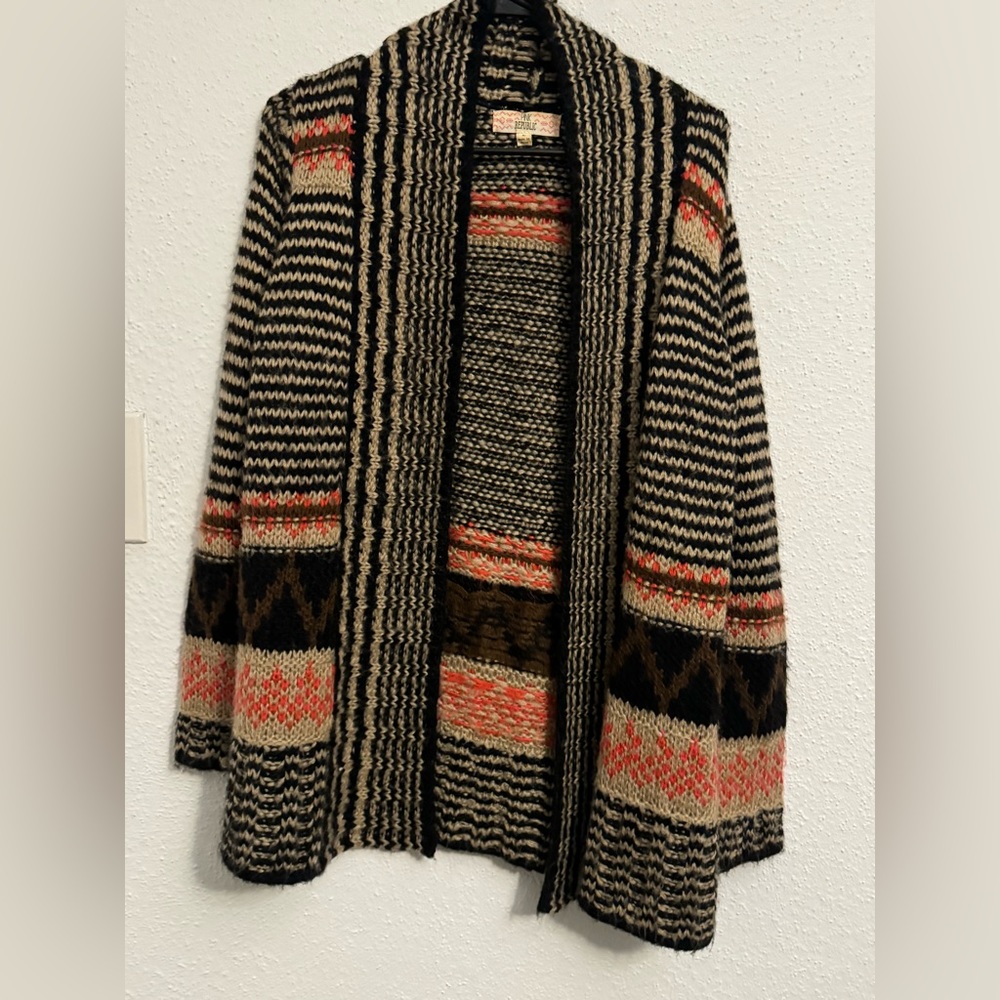 Lightly worn sweater with nice colors. Heavy enough for winter!